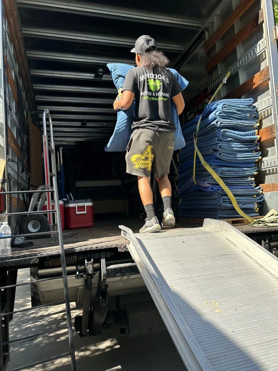 Murdock’s crew unloading a protected item from a moving truck