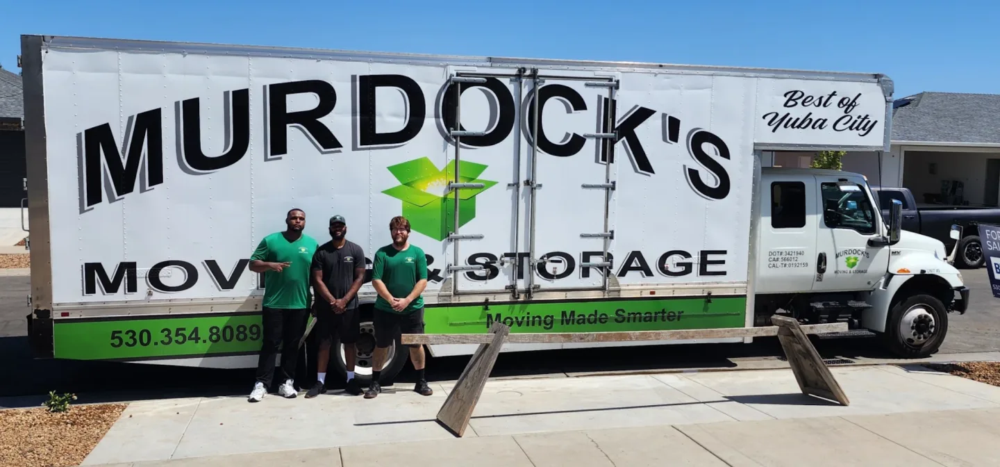 Murdock’s moving crew beside a branded truck in Yuba City